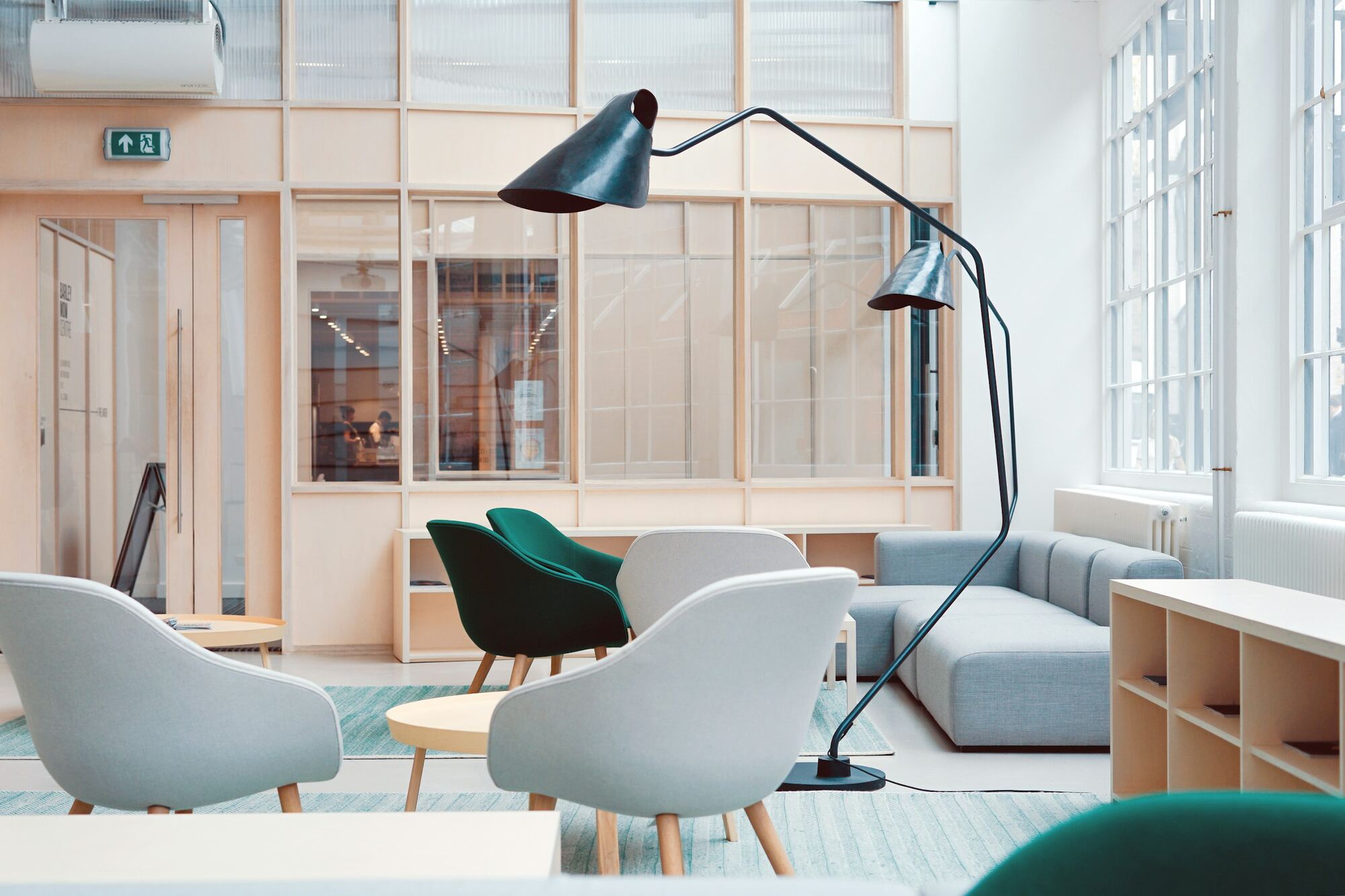 A an informal meeting setting with warm materials and soft lighting
